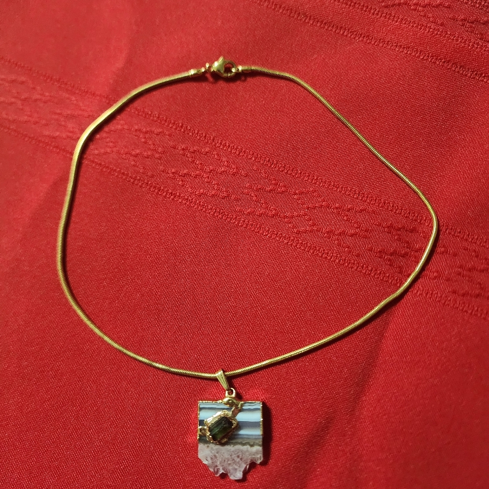 Necklace with quartz saying.